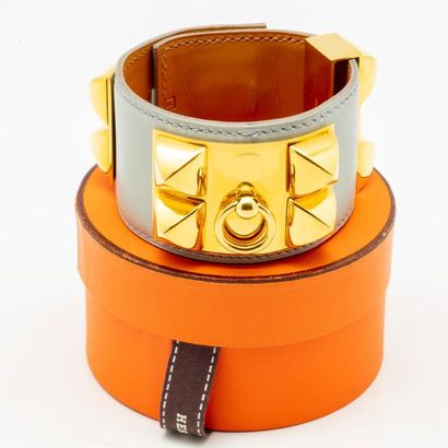 HERMES HERMES Paris
Studded smooth calf leather bracelet, decorated with a golden...
