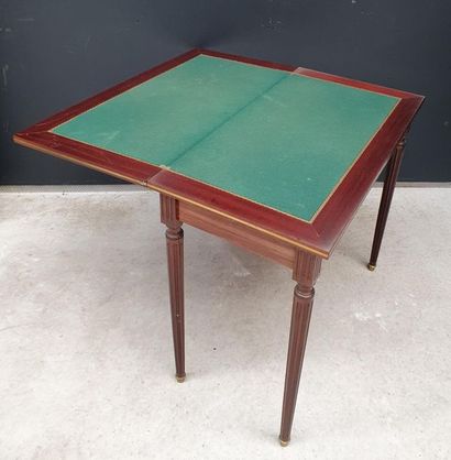 null Rectangular shaped game table made of veneer wood and framed with brass nets....