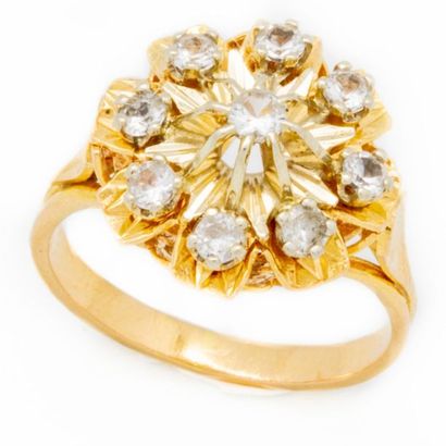 null Yellow gold ring decorated with a division of small diamonds forming a flower...