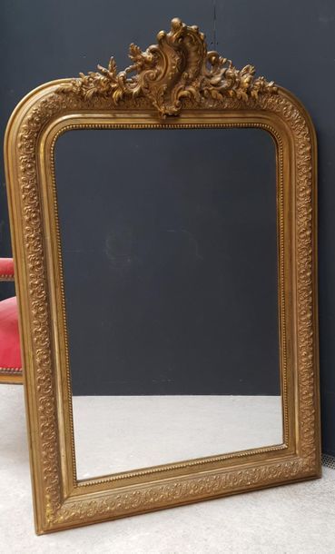 Wood and gilded stucco mantel mirror molded...