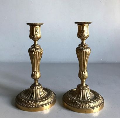 Pair of gilt bronze candleholders molded...