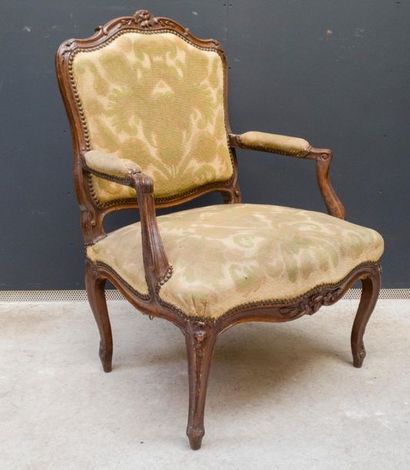 Armchair in natural wood molded and carved...