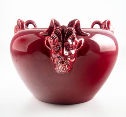 Red enamelled earthenware planter with satyr...