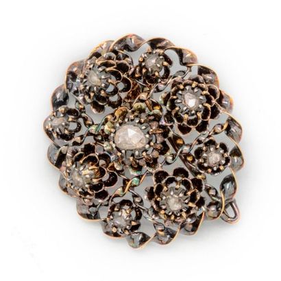 Gold brooch decorated with a central TA diamond...