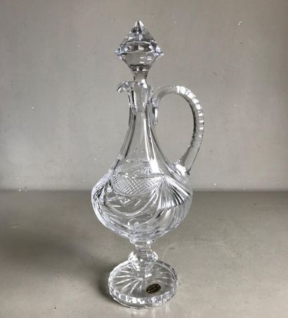 Large covered carafe on a blown and cut crystal...