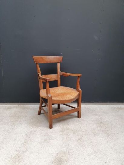 null Armchair "bonne femme" in fruit wood with straw seat. 19th
Restoration