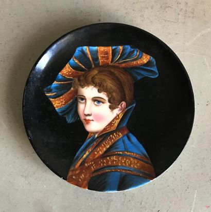 null Small porcelain plate decorated with a black background of a woman in a bust...