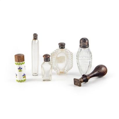 null Set of cut glass and porcelain perfume bottles, a wooden seal is attached to...
