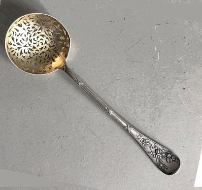 null Silver sugar spoon with spatula chiselled with flowers and crossed ribbons....