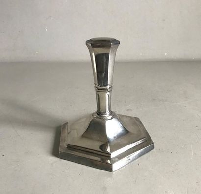 null Polygonal shaped paperweight with silver metal moulded grip in Art Deco style....