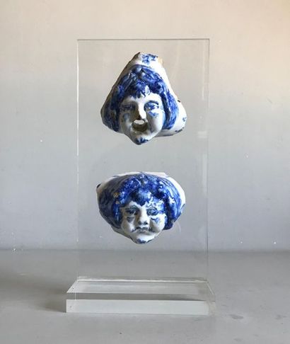 null Two marmoset heads for a glazed earthenware fountain mounted on a plexiglass...