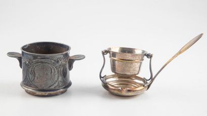 null Two silvery mustard makers (one glass jar is missing), an egg cup and a spoon,...