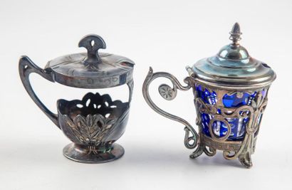 null Two silvery mustard makers (one glass jar is missing), an egg cup and a spoon,...