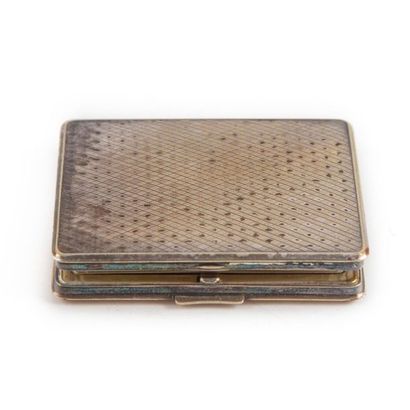 null Alpacca powder case with guilloche decoration and engraved with foliage inside.
H.:...