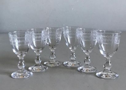 null A suite of six liqueur glasses on a crystal base engraved with a rotating frieze....