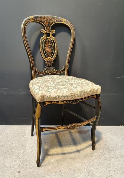null Small blackened wood flying chair with painted gold decoration. Upholstered...