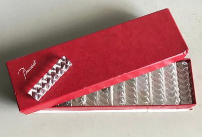 BACCARAT BACCARAT 
A set of twelve crystal knife holders in the shape of a braid.
In...