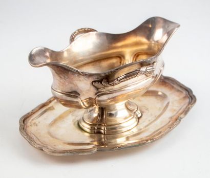 null Gravy boat in the shape of a shuttle on its silvery metal frame moulded and...