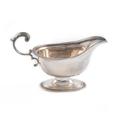 null Small gravy boat on a silvery metal pedestal. English work