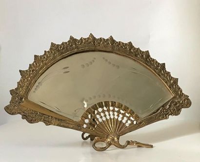 null Small gilt bronze mirror in the shape of a fan with chiselled decoration. Late...