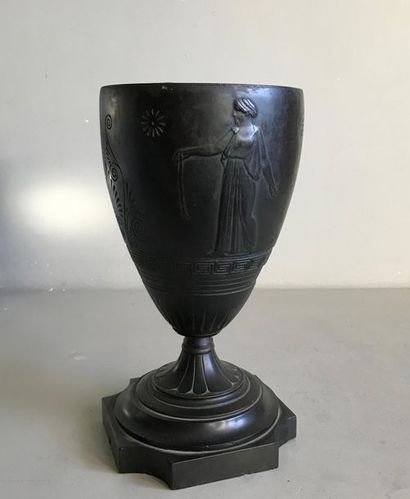 null Large urn on pedestal in patinated bronze carved with a frieze of characters...