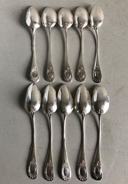 null Suite of ten small silver spoons engraved with a leaf medallion. Louis XVI style....