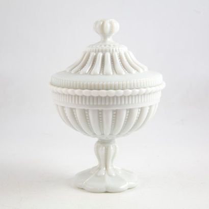 null Covered drainer on a white opaline glass base with moulded relief decoration....