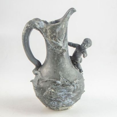 null VAN de VOORDE
Pewter pitcher decorated with a putto. Early 20th century
Signed
H.:24...