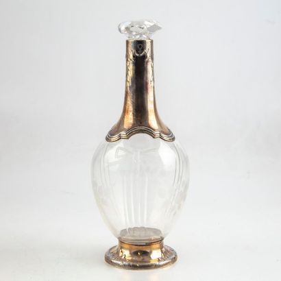 null Crystal decanter with engraved decoration in a moulded silver frame in the Louis...
