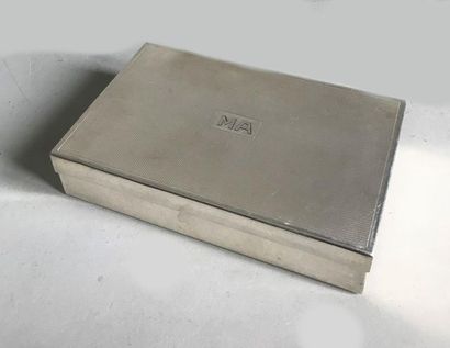 null Rectangular cigarette box made of silver plated metal. The lid is guilloche...