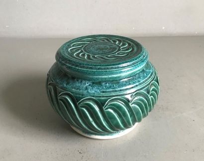 null Covered green glazed ceramic pot with wave decoration in slight relief. Signed....