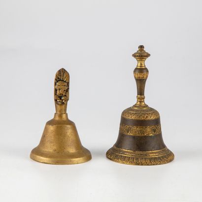 null Table bell in finely chiselled bronze with a vine motif. A second bell is attached...