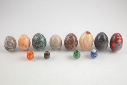 null Set of 11 decorative hard stone eggs of various sizes. One ceramic egg is a...