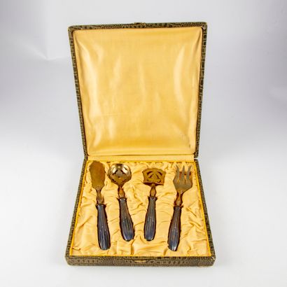 null Small gold metal serving set with silver metal handles.