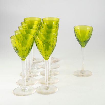 null Suite of 11 green cut crystal stemmed glasses.