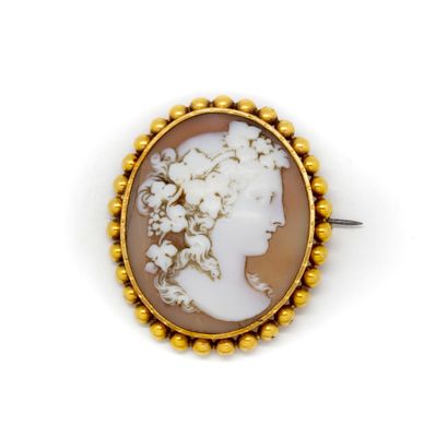 null Large cameo with the profile of a woman wearing a vine leaf and grape headdress,...