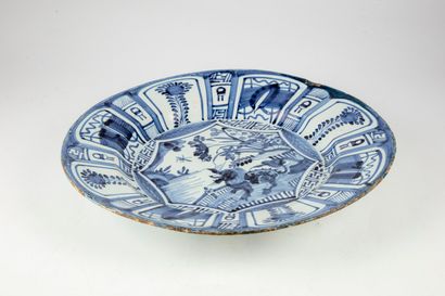 null Large round enamelled earthenware dish with blue and white decoration. 

D....