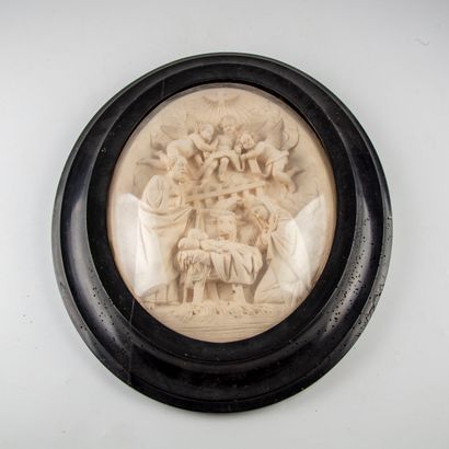 null Large medallion representing the nativity in limestone under glass. 

Blackened...