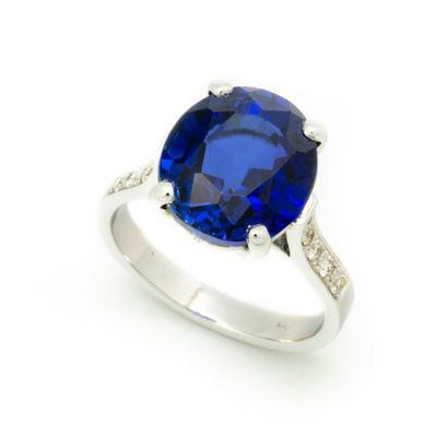 null 18 k white gold ring set with a synthetic sapphire weighing about 8 cts and...