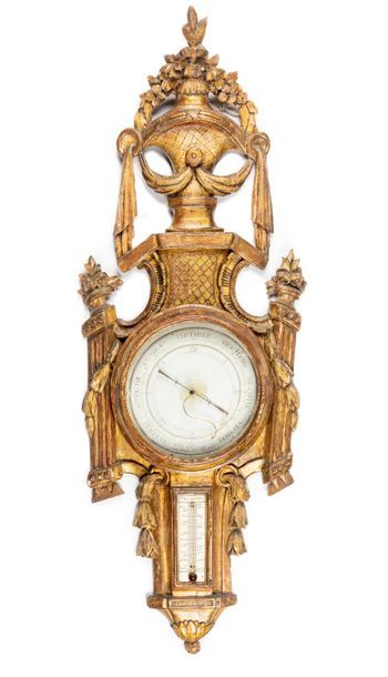 null Important barometer-thermometer in gilded wood molded and carved with garlands...