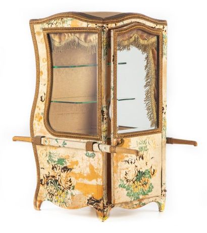 null Table showcase in the form of a chair with a carrier covered with floral silk...