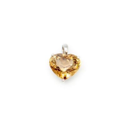null Pendant in white gold forming a heart decorated with an imperial topaz weighing...