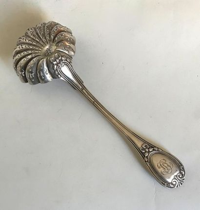 null Silver sugar spoon with spatula molded and chiselled with leaves, shells and...