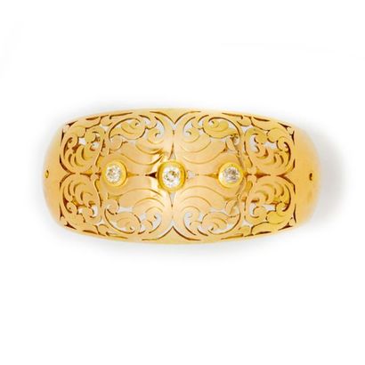 null Articulated 18 k yellow gold cuff bracelet decorated with a pierced pattern...