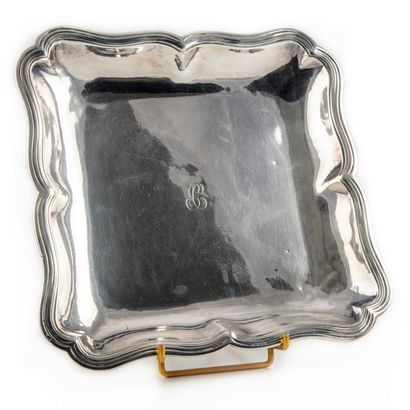 null Square shaped bowl with an animated silver moulded border with fillets and contours....