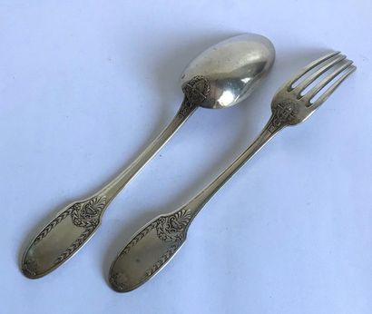 null Beautiful silver cutlery molded and carved with garlands of laurel and palmettes....