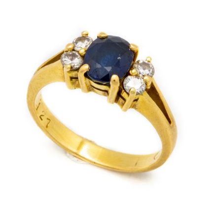 Small yellow gold ring decorated with a sapphire...