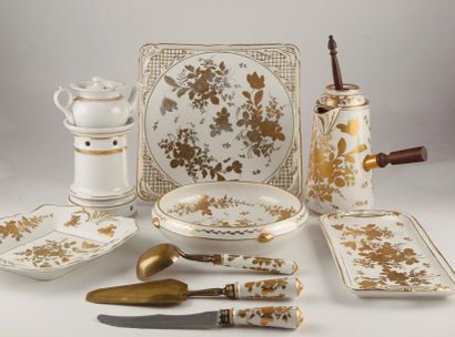 null Set of porcelain tableware in the taste of Paris with golden roses decoration...