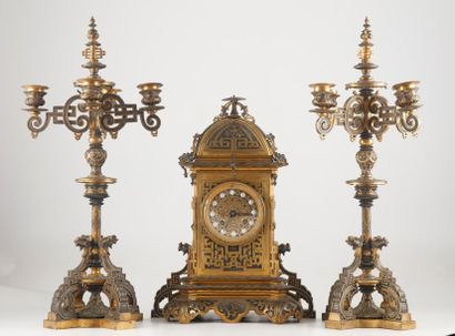 null Mantel set comprising a clock and two bronze candelabra moulded and chiselled...