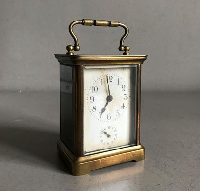 null Travelling or officer's clock in bronze and glass. Double dial. Arabic numerals....